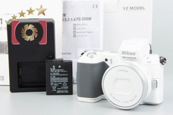 Count 2,503  Nikon 1 V2 White 14.3MP + 1 NIKKOR 10-30 3.5-5.6 VR New Model Sale