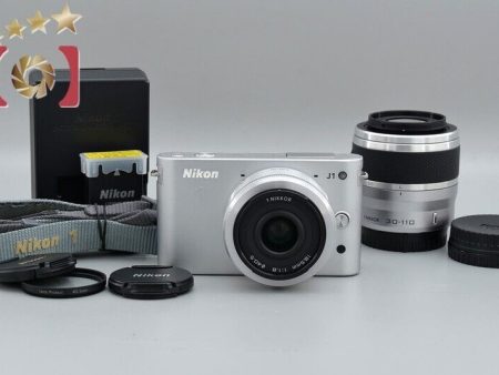 Count 4,286  Nikon 1 J1 Silver 10.1 MP Digital Camera + Double Lens Kit Supply